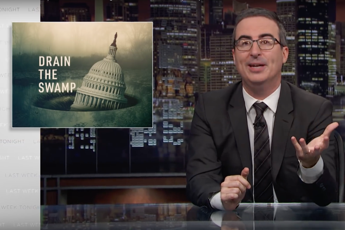 Last Week Tonight's John Oliver in front of a graphic reading "Drain the Swamp."