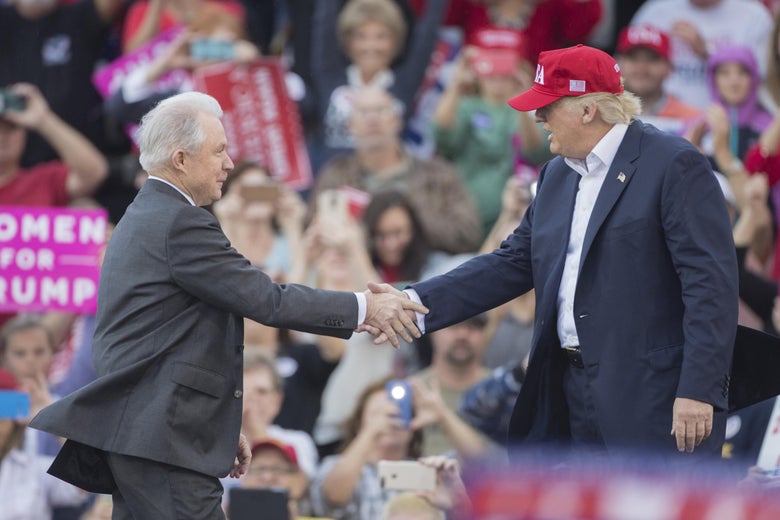 Donald Trump and Jeff Sessions shake hands onstage.