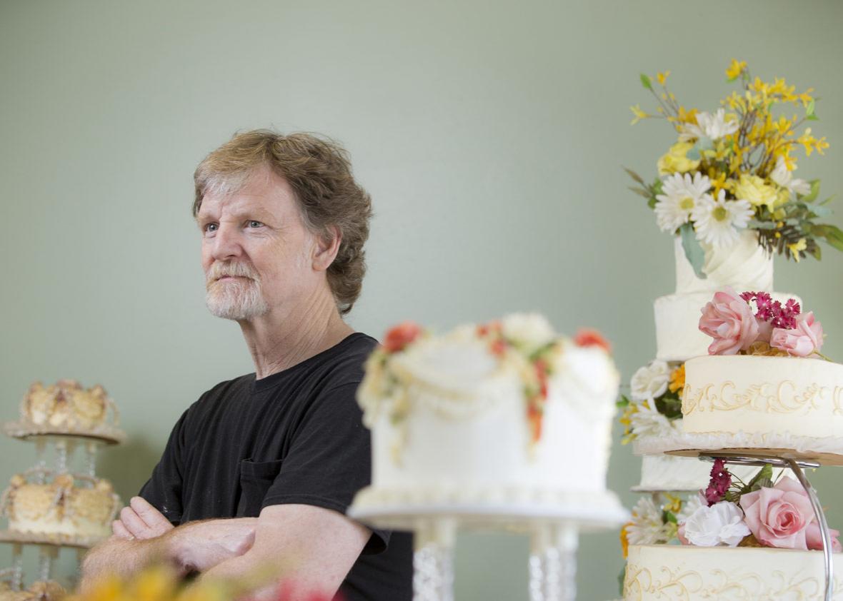 Jack Phillips stands for a portrait near a display of wedding cakes in his Masterpiece Cakeshop 