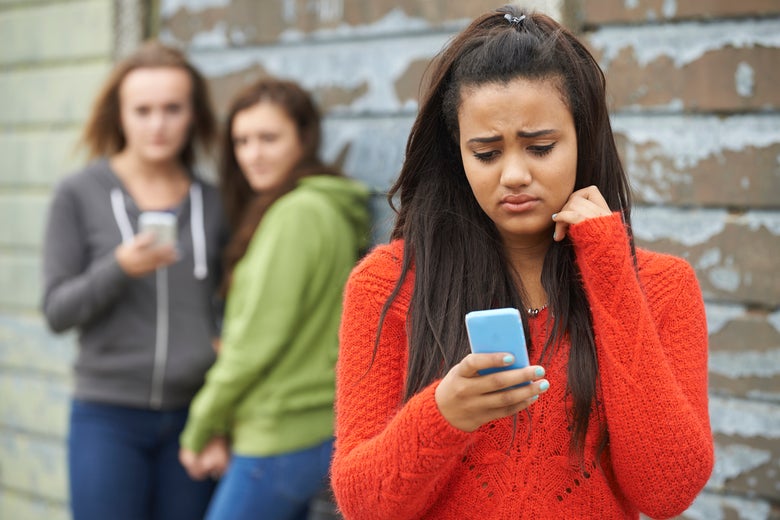 Image result for image of a teen looking at her phone sad