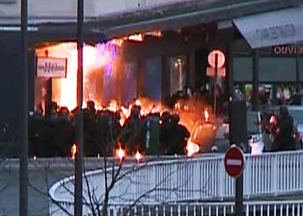 French police special forces launching an assault at a kosher grocery store.