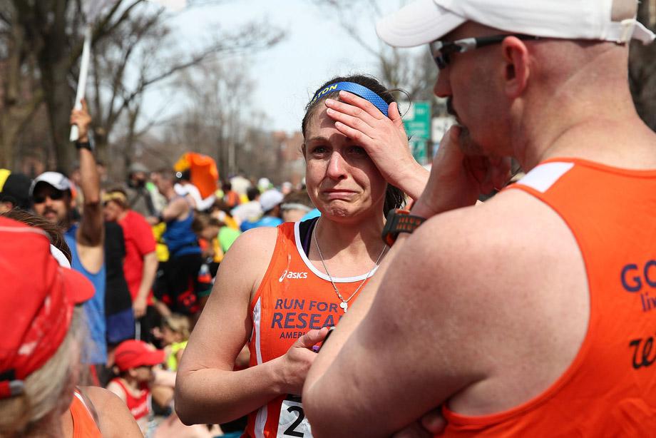 A runner reacts near Kenmore Square after two bombs exploded during the 117th Boston Marathon on April 15, 2013 in Boston, Massachusetts. 