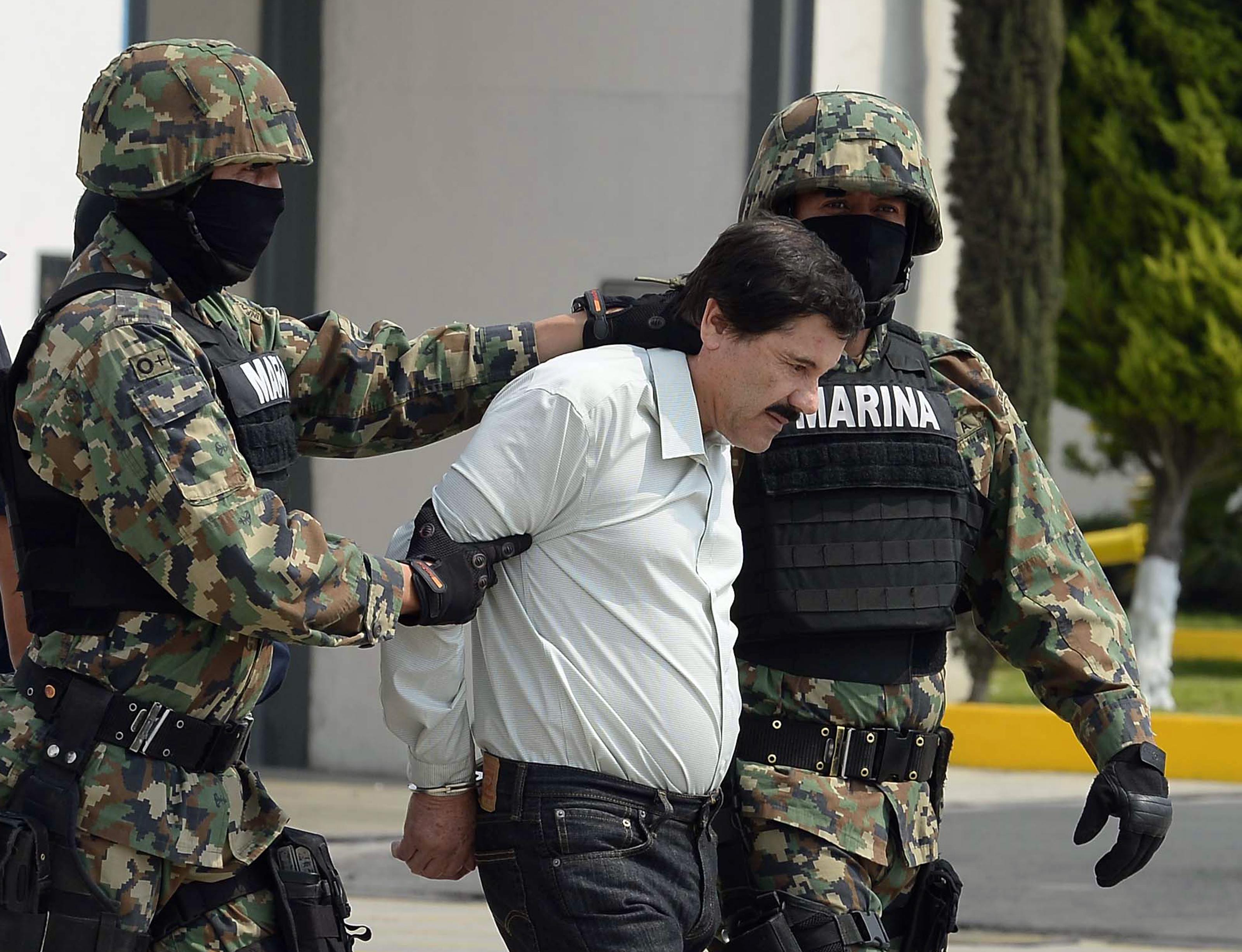 Marines present Mexican drug lord Joaquín “El Chapo” Guzmán to the press in Mexico City after his arrest on Feb. 22, 2014.