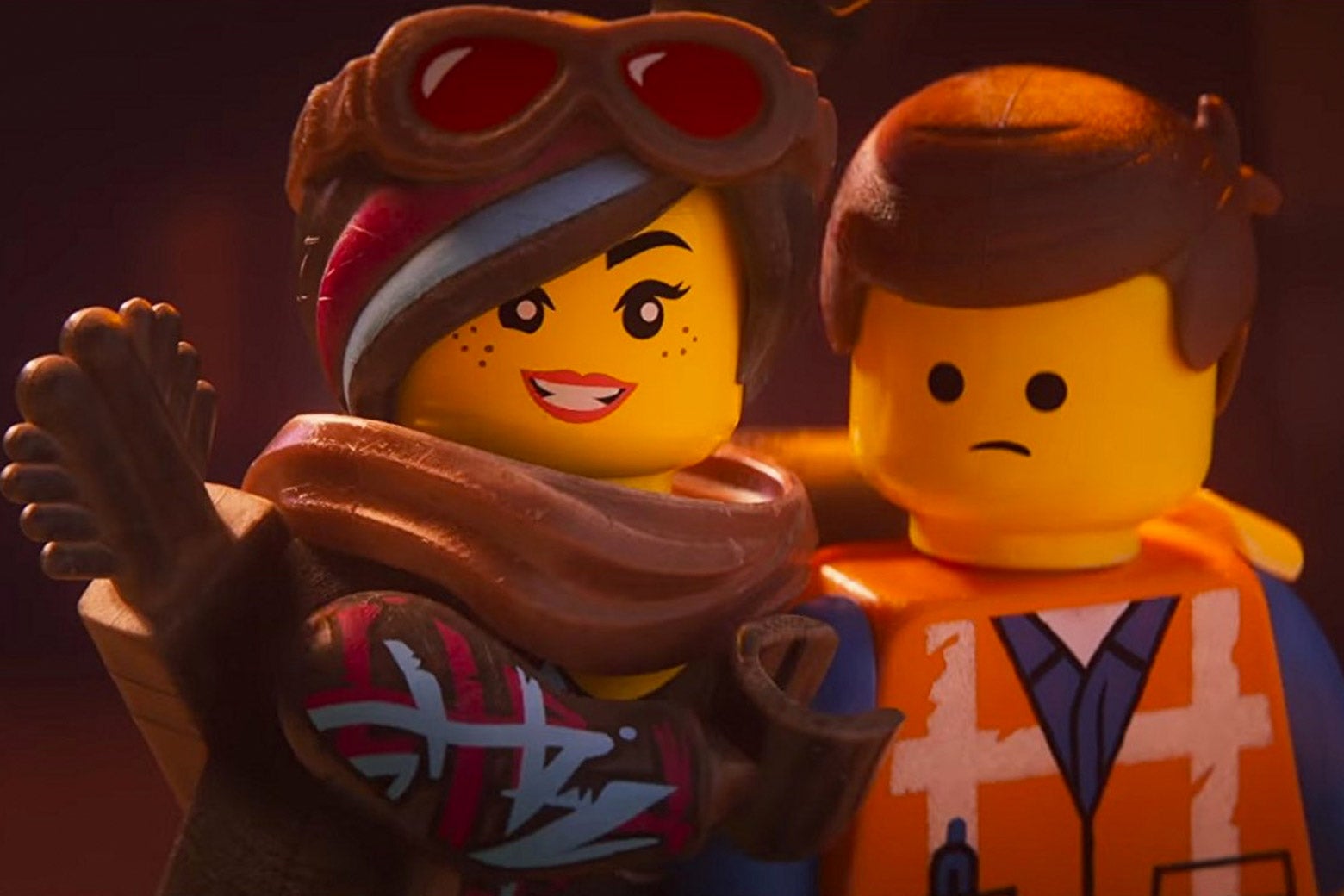The Lego figurines Wyldstyle and Emmet.