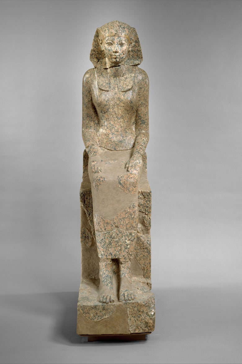 Statue of a standing woman with a pharaoh's headscarf.