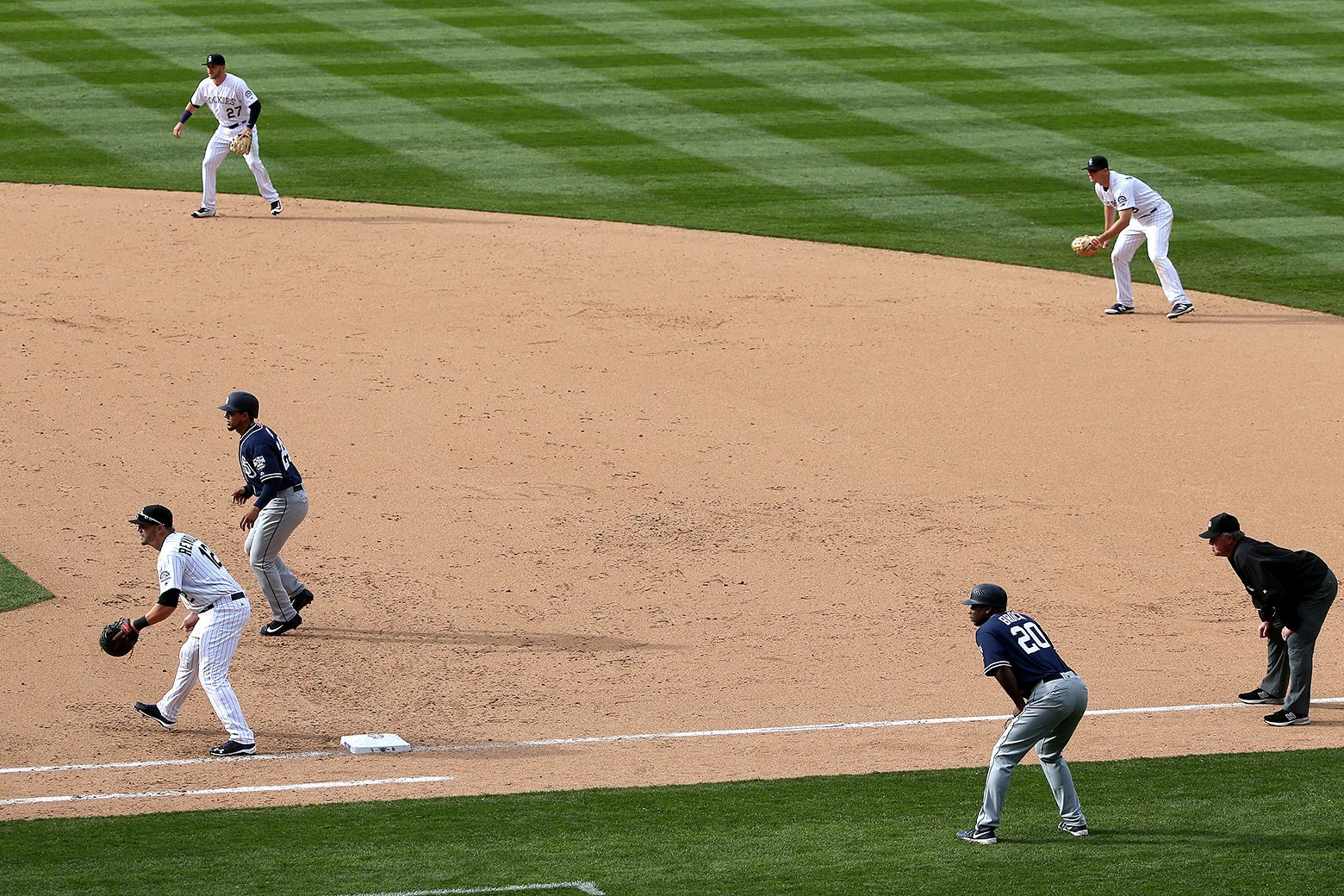 Colorado Rockies infielders Trevor Story, DJ LeMahieu, and Mark Reynolds play a defensive shift against the San Diego Padres on Apr. 8, 2016.