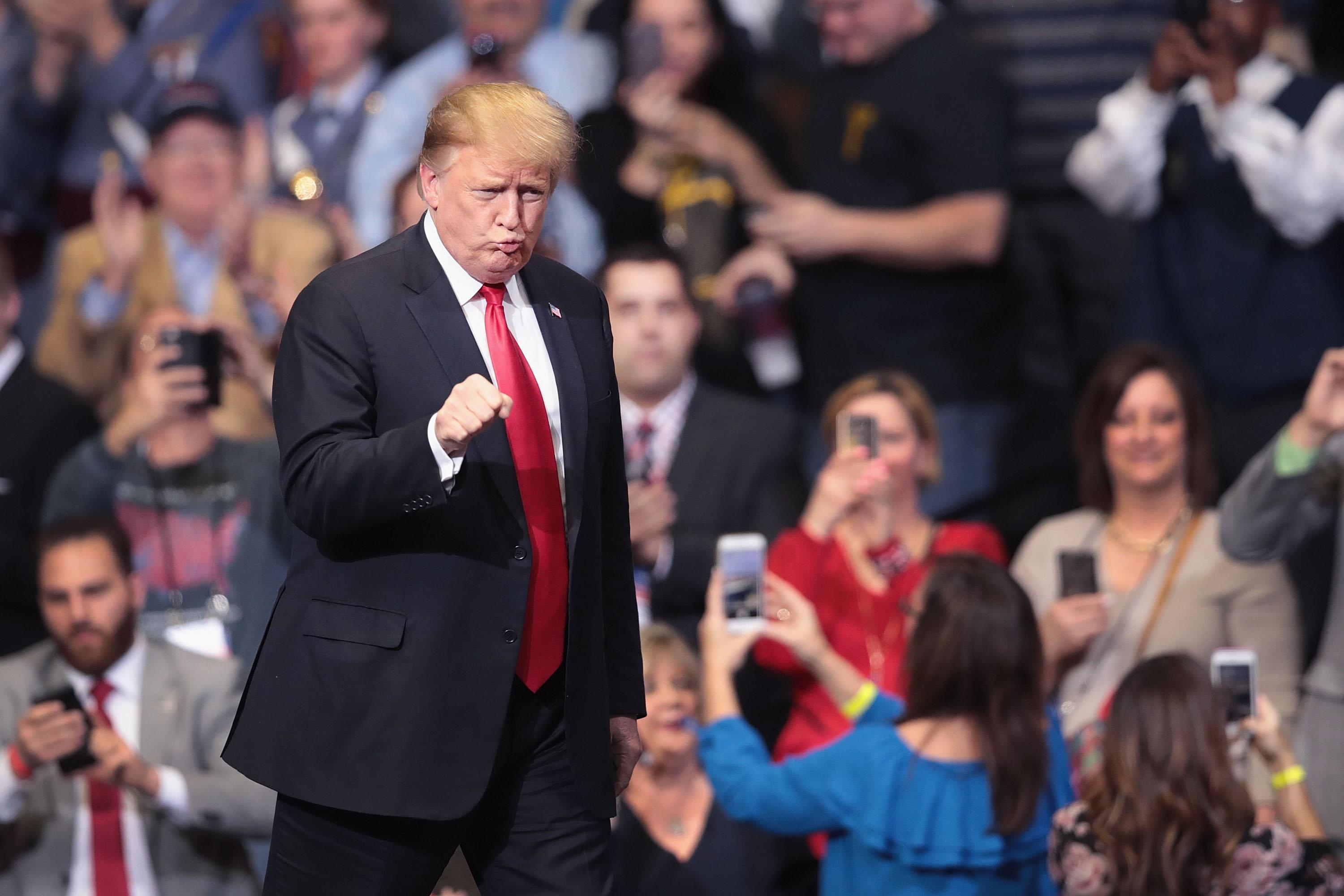 President Donald Trump greets supporters during a rally on March 28 in Grand Rapids, Michigan. 