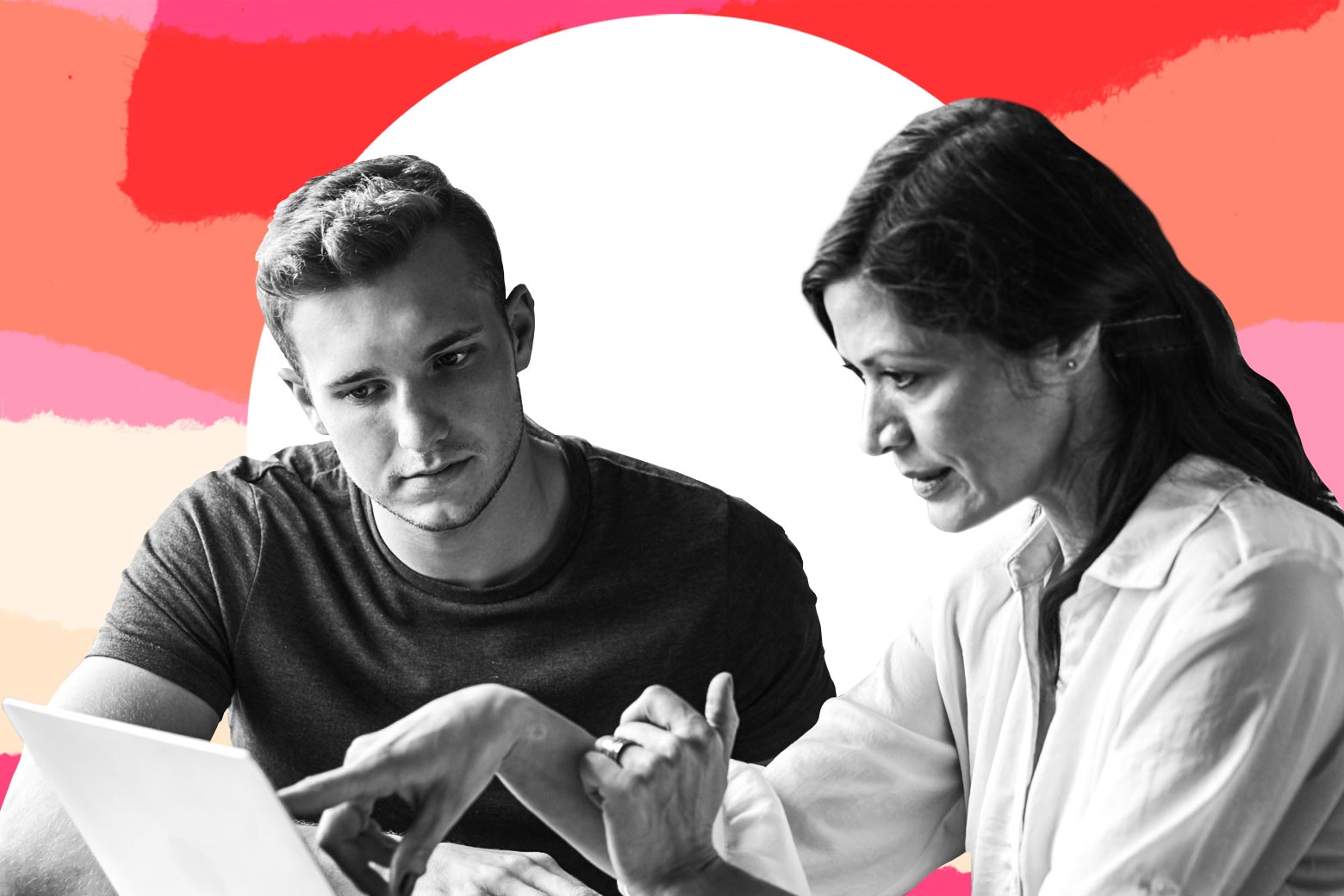 Woman talking to teen boy while pointing at a computer.