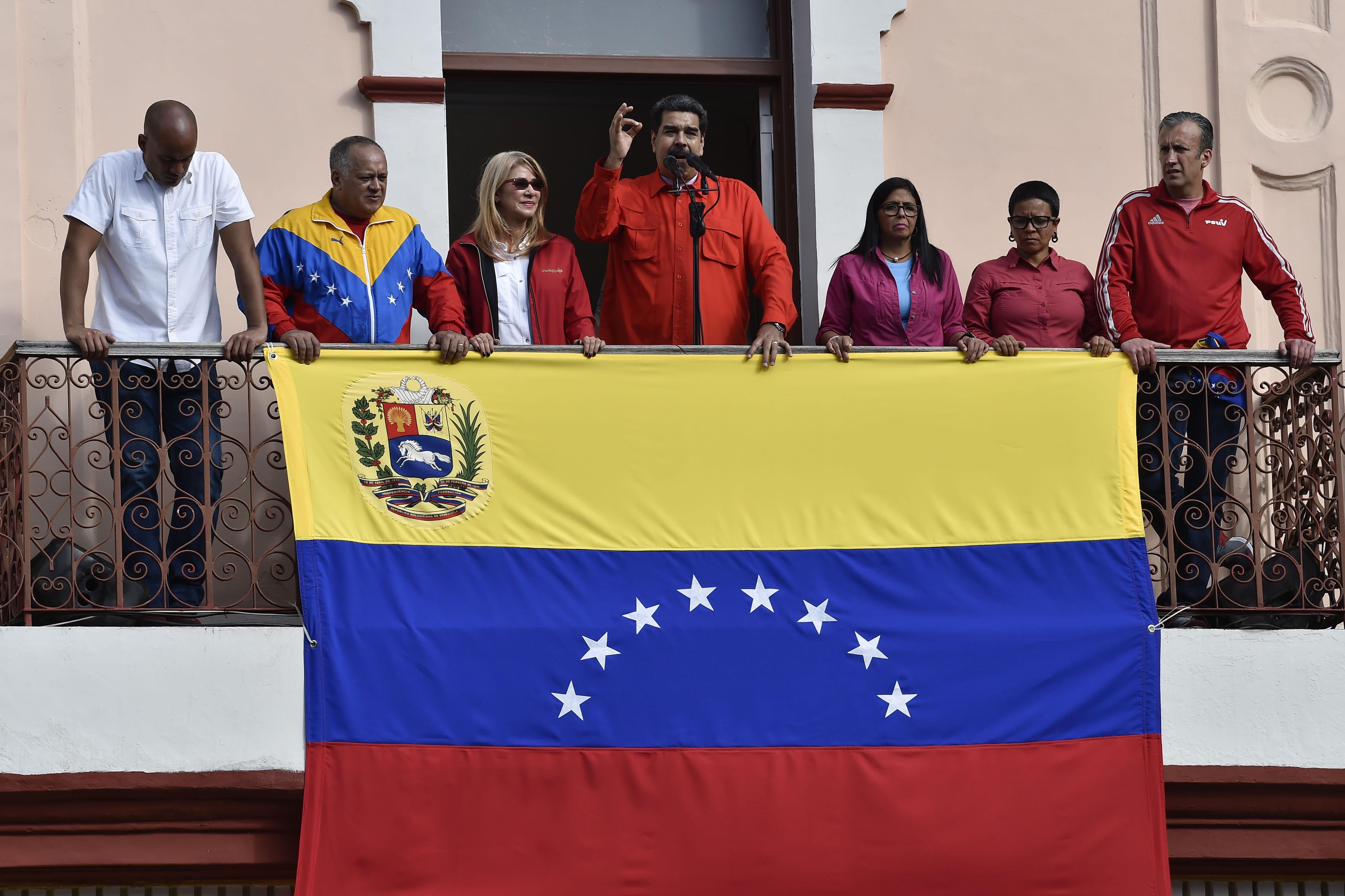 Venezuela's President Nicolas Maduro speaks from a balcony at Miraflores Presidential Palace to a crowd of supporters during a gathering in Caracas on January 23, 2019.