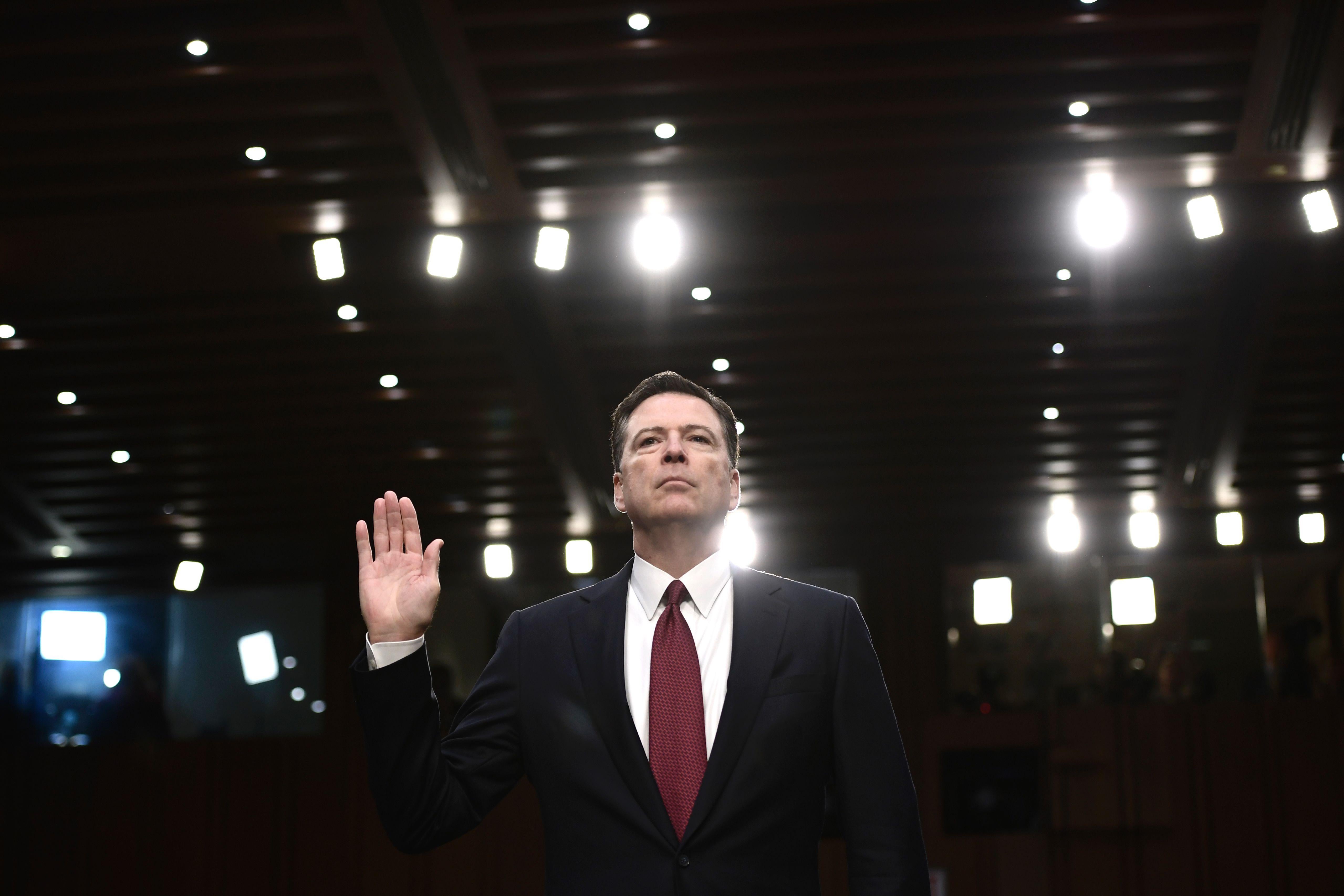 Ousted FBI director James Comey is sworn in during a hearing before the Senate Select Committee on Intelligence on Capitol Hill June 8, 2017 in Washington, DC. 