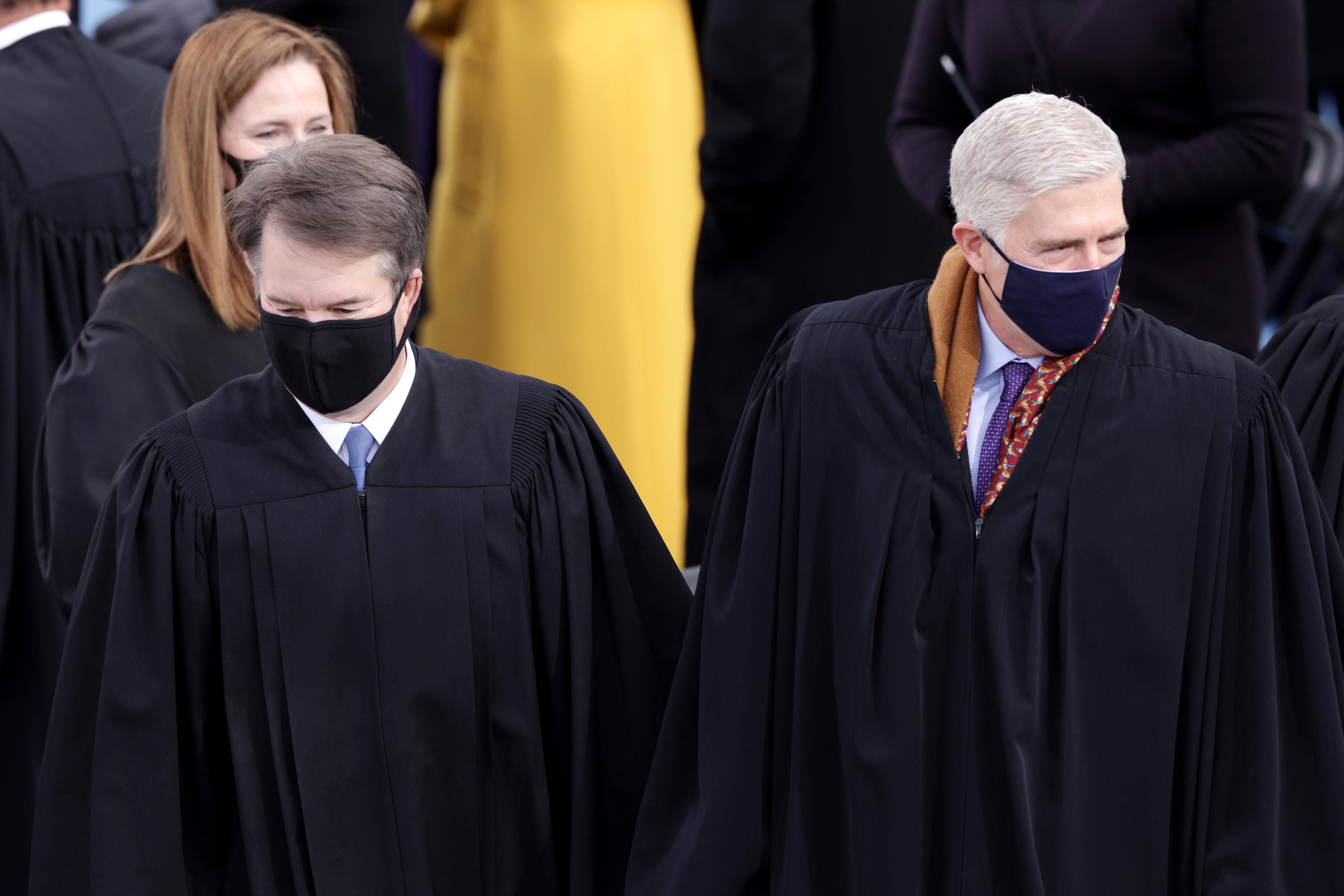 The three justices stand in their robes at Joe Biden's inauguration