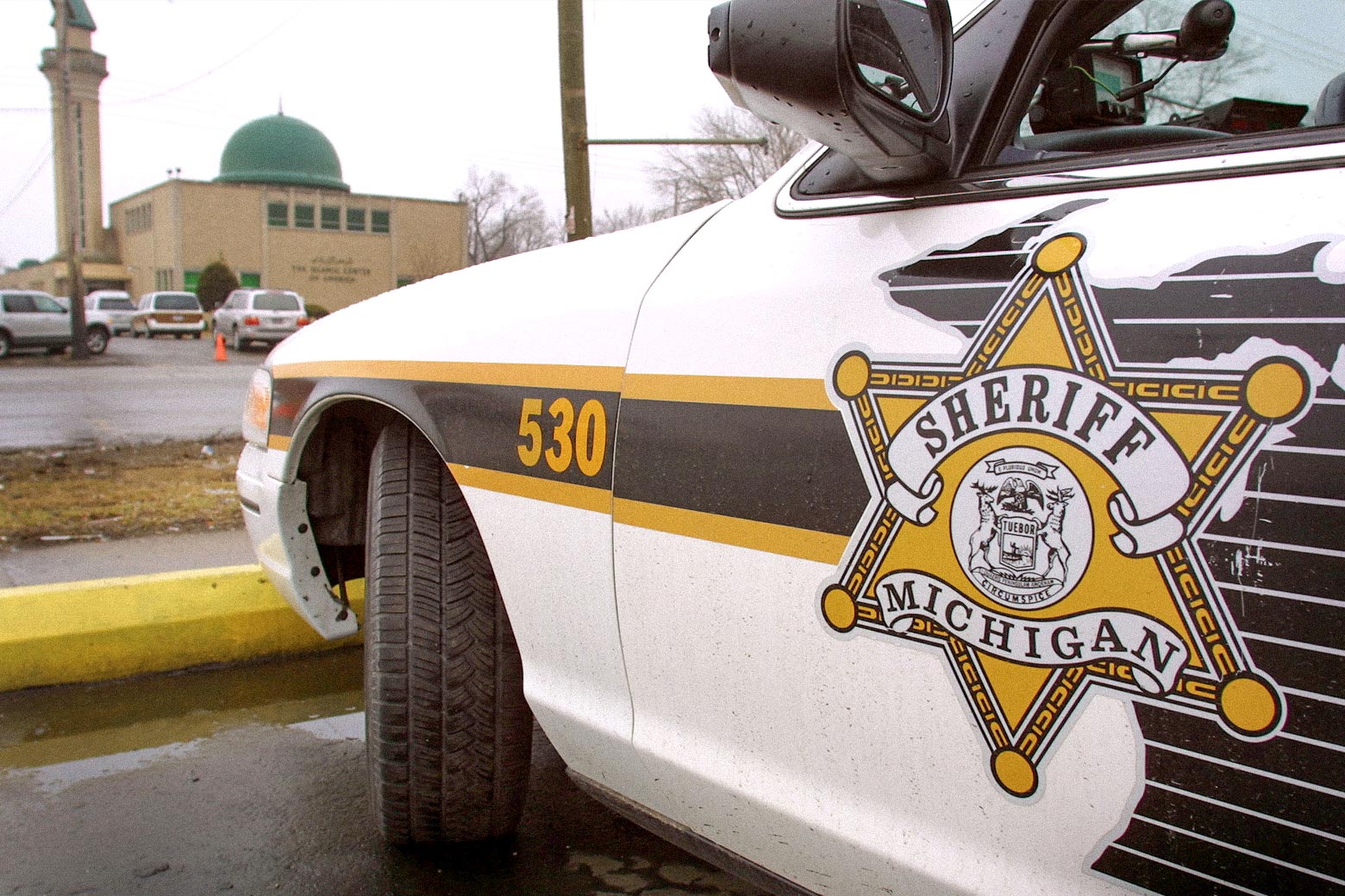 A Wayne County Sheriff's vehicle parked outside an Islamic center.