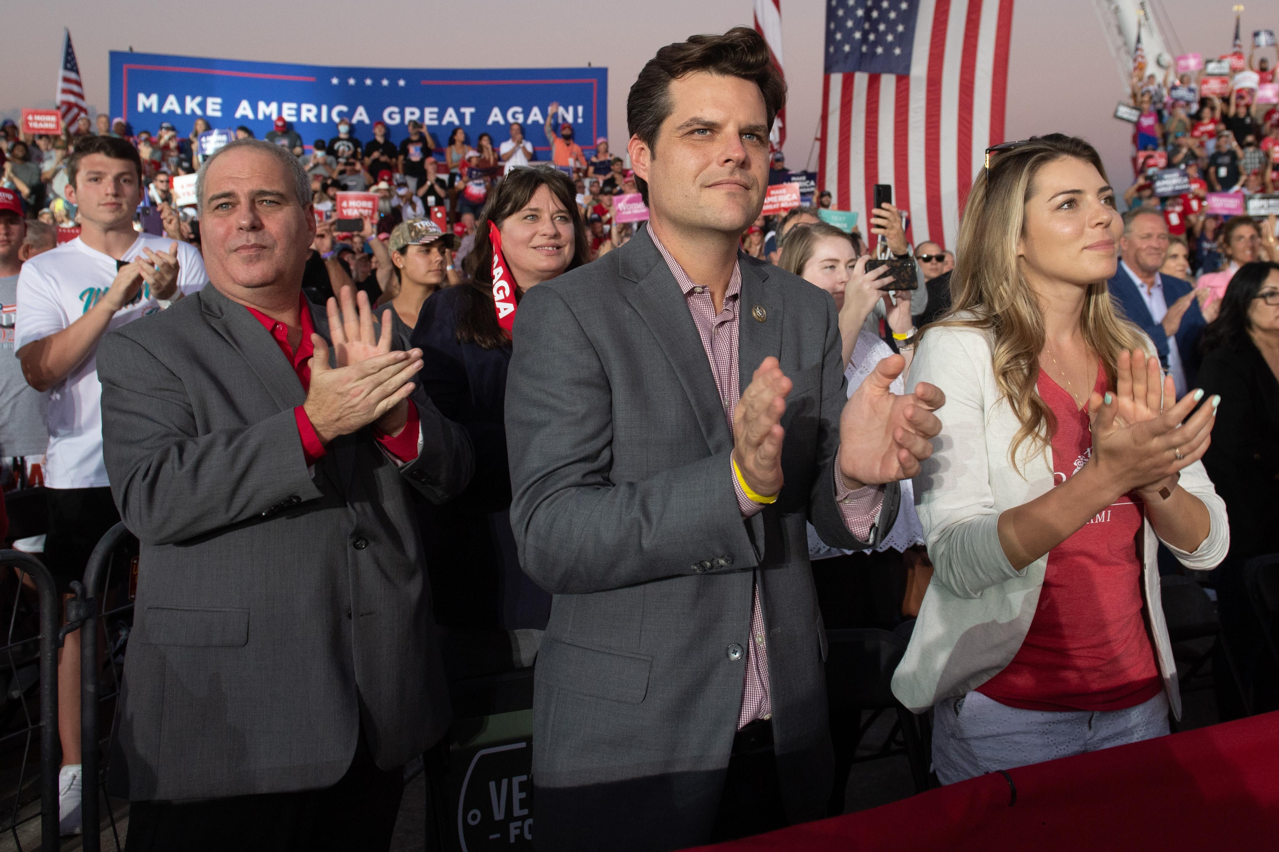 US Representative Matt Gaetz (C), Republican of Florida, applauds as US President Donald Trump holds a Make America Great Again rally as he campaigns at Orlando Sanford International Airport in Sanford, Florida, October 12, 2020. (Photo by SAUL LOEB / AFP) (Photo by SAUL LOEB/AFP via Getty Images)