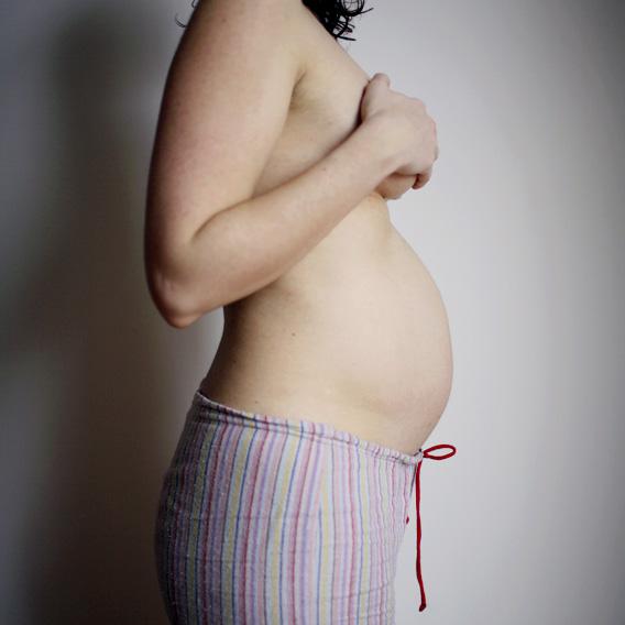 Woman, 5 months pregnant.