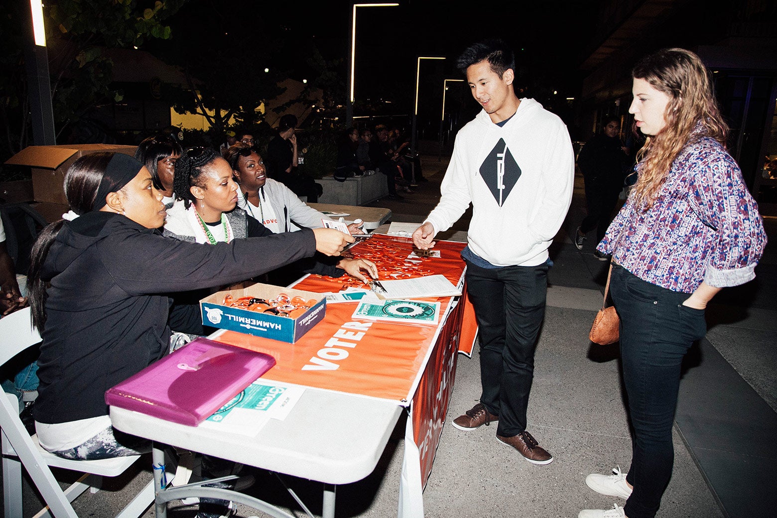 Young people registering to vote at a concert