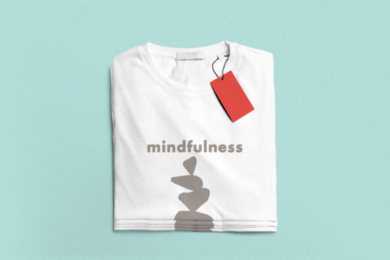 A white t-shirt with an image of pile of grey stones printed on the shirt, and also the word "mindfulness". The shirt has a big red price tag. 