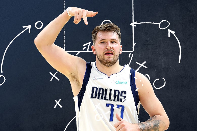 Luka directing traffic on the floor with an X's and O's play drawn around him
