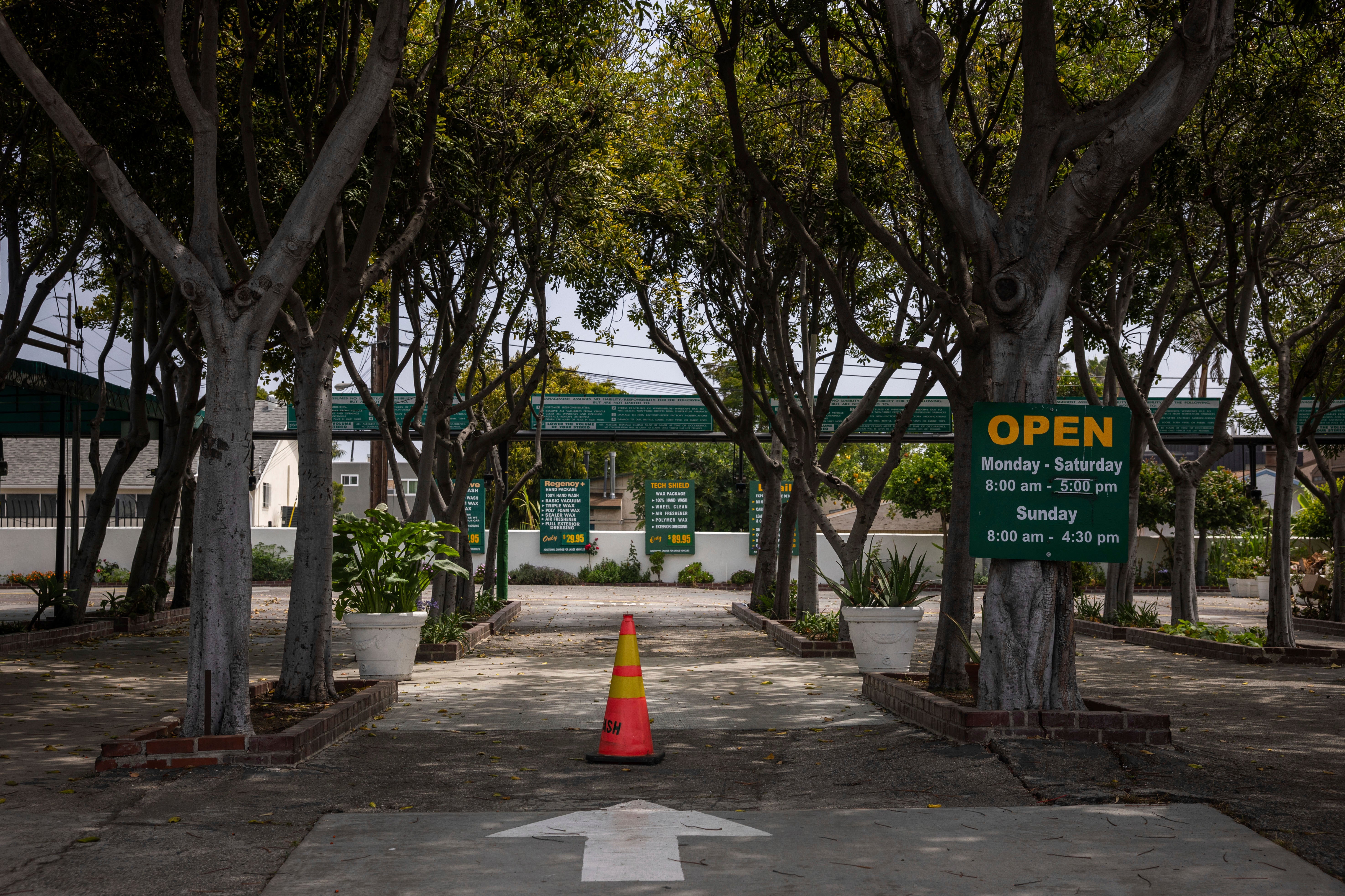Orange cones block off a car wash entrance.