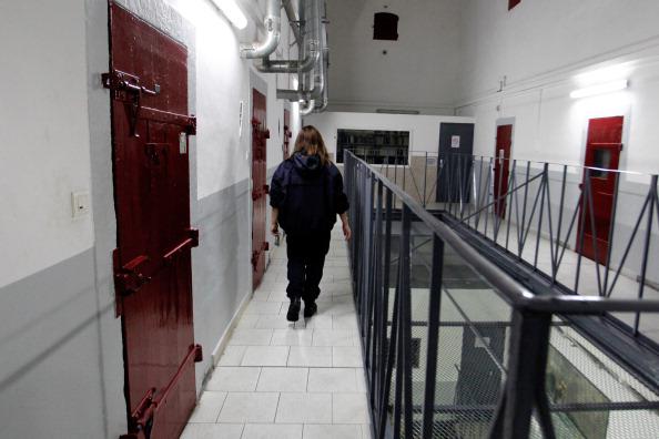 A prison guard walks through a corridor at the Ajaccio's jail on January 24, 2013, in Ajaccio, Corsica.