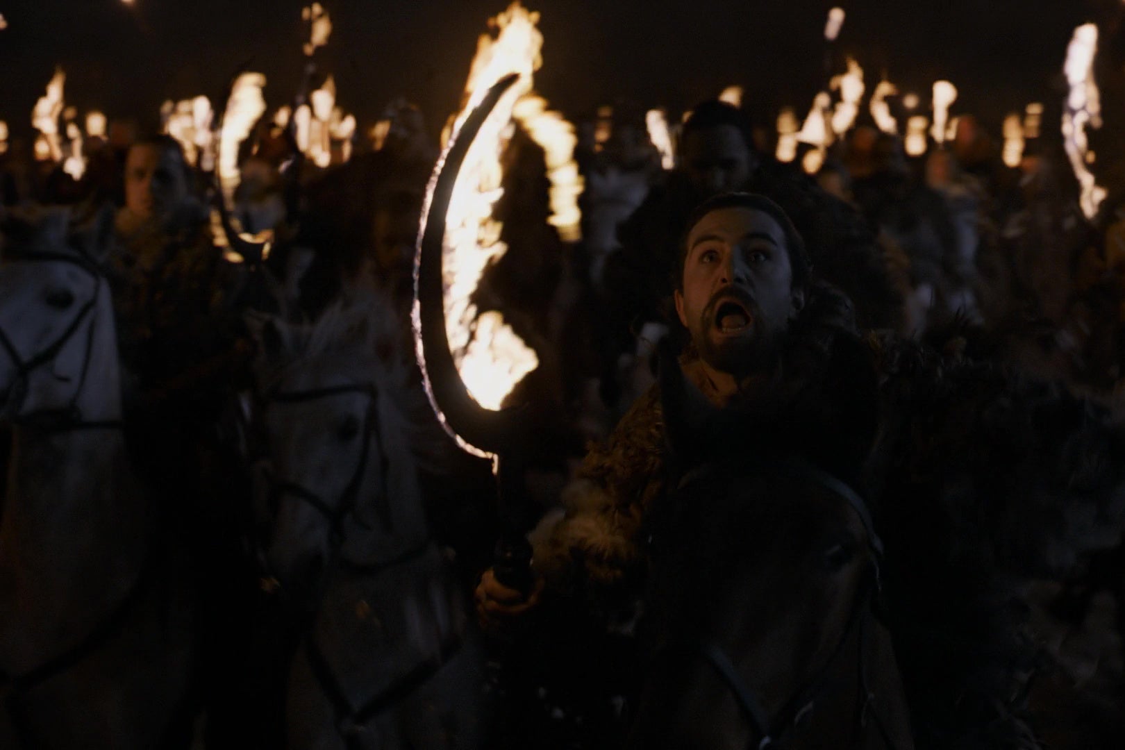 A Dothraki warrior, riding toward camera, looking up in horror at whatever he's riding toward.