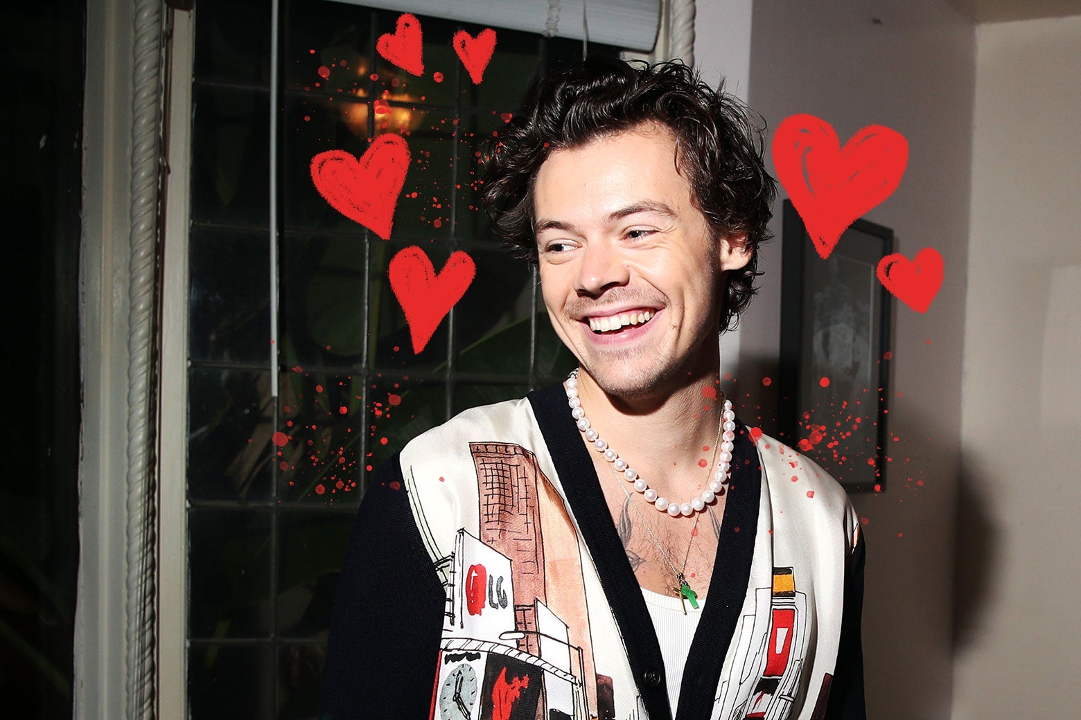 Harry Styles with hand-drawn red hearts around him.