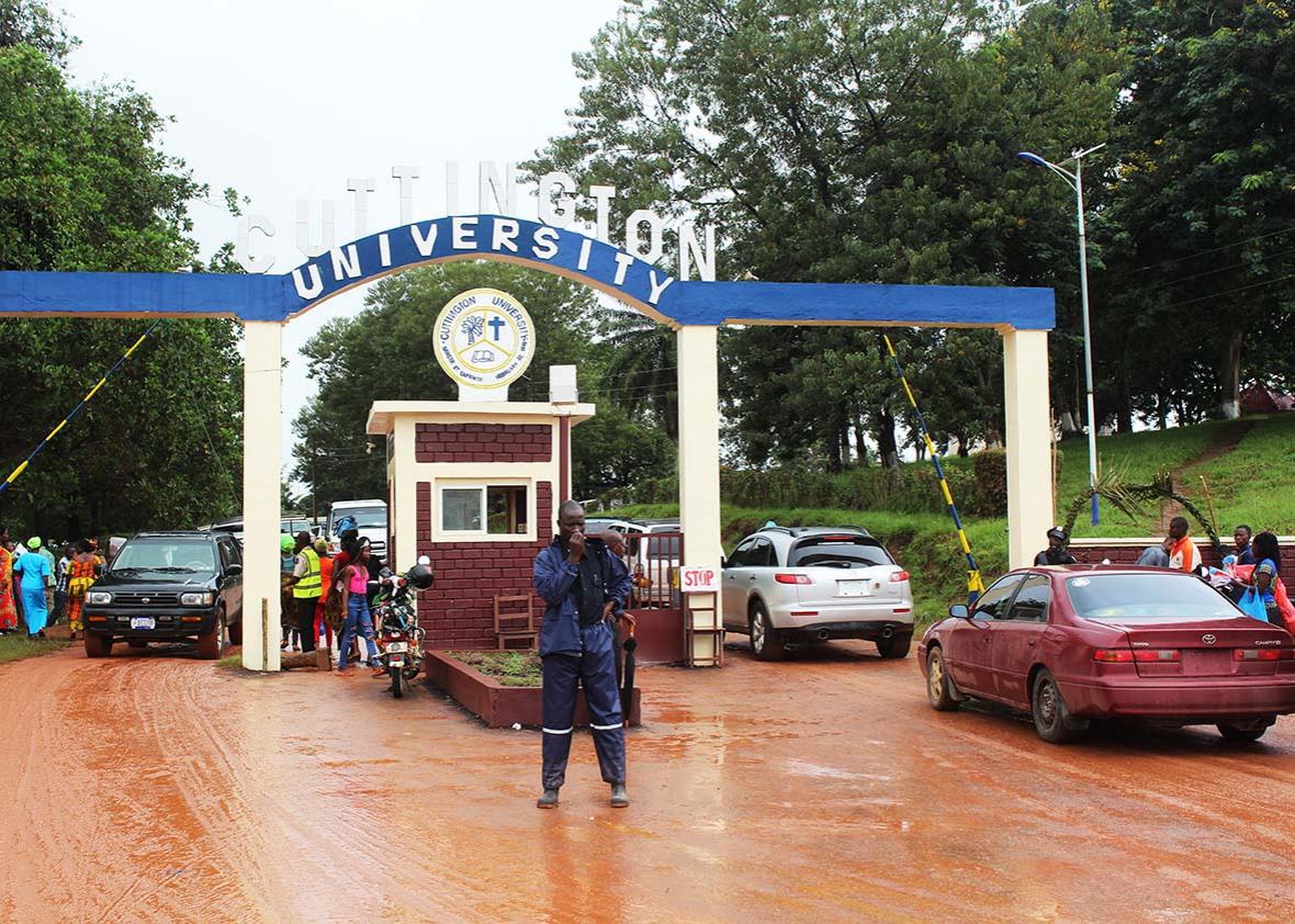 Security guard in front of main gate of Cuttington University.  Picture taken on morning of commencement ceremony.