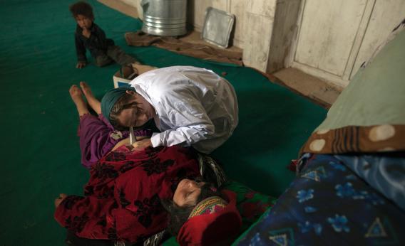 Afghani woman giving birth. 