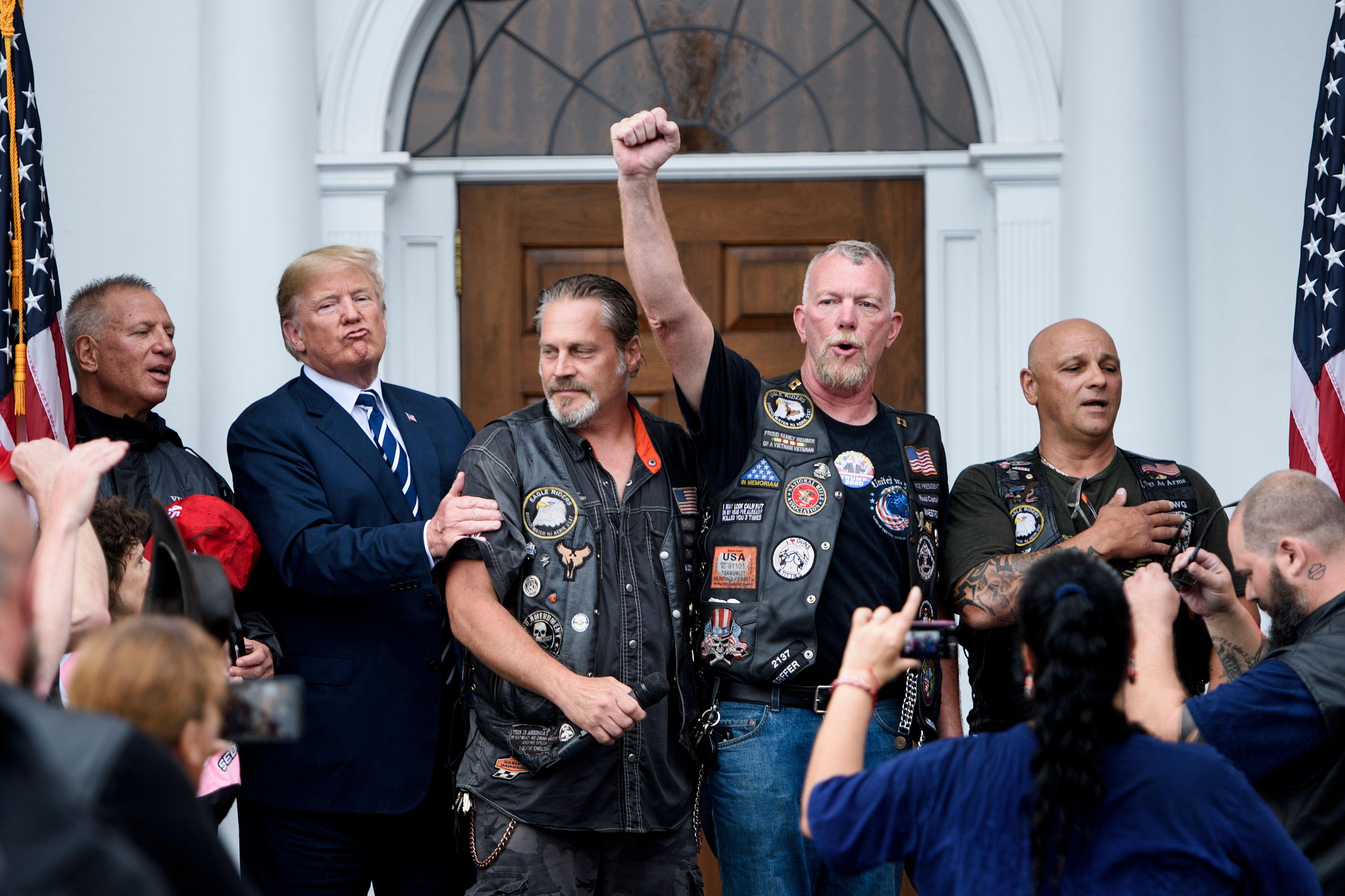Trump posing for photos with a group of bikers