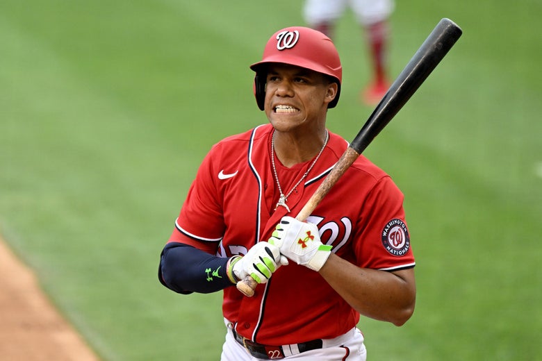 Juan Soto grimaces after being called out on strikes, holding his bat to his shoulder