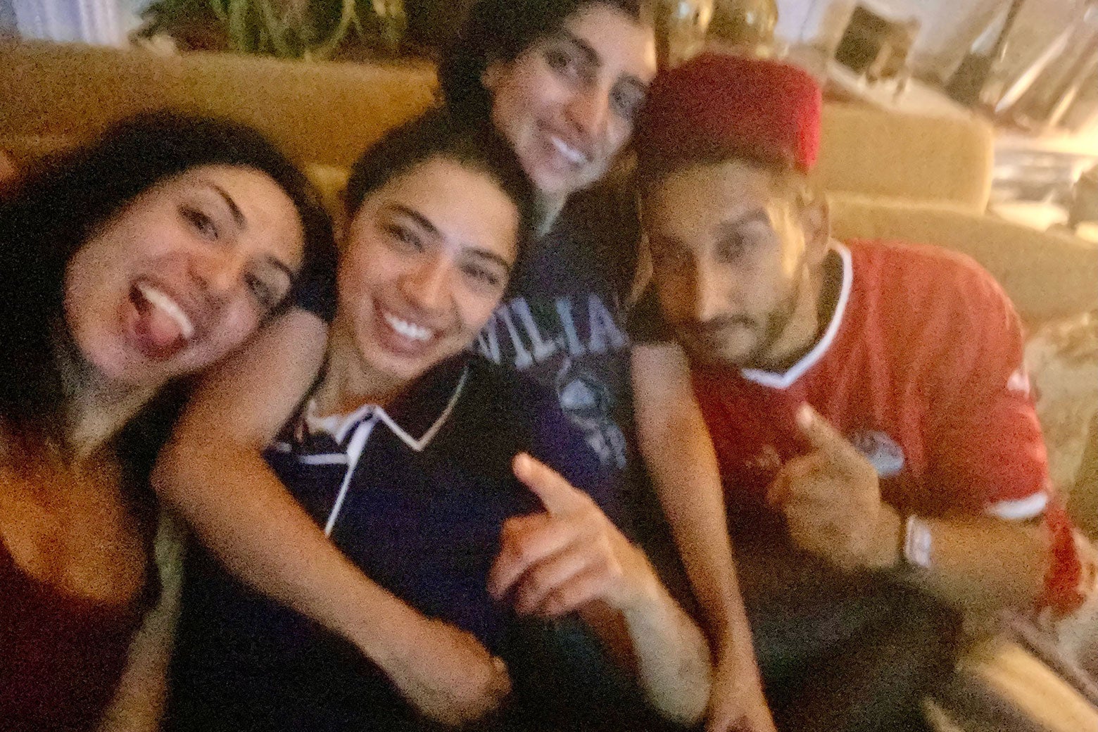 A group selfie of watching soccer and holding up fingers for No. 1.