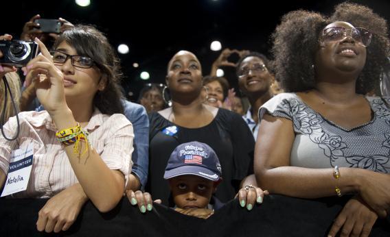 Supporters listen as Pres. Obama speaks during a campaign event.