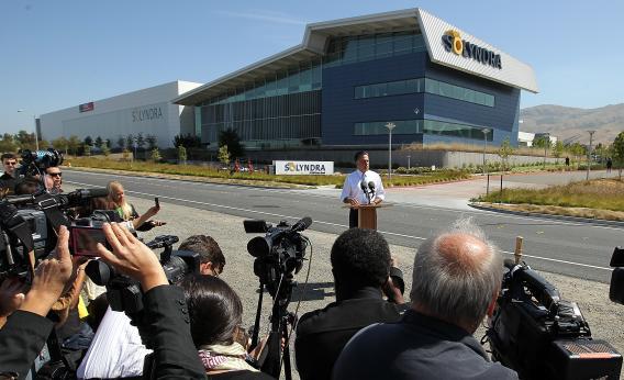 Mitt Romney poses for a Solyndra photo op in May.