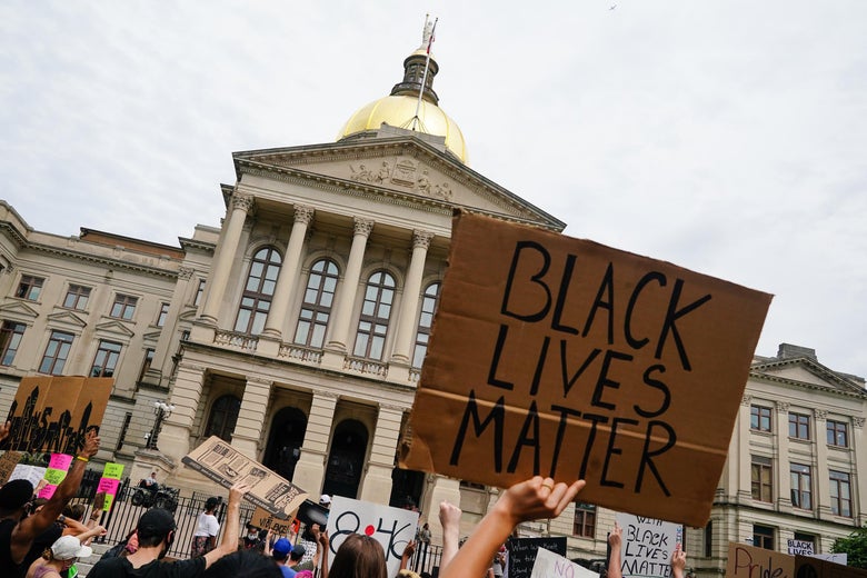 People gather outside the Georgia State Capitol during a protest against police brutality on June 6, 2020 in Atlanta, Georgia. 
