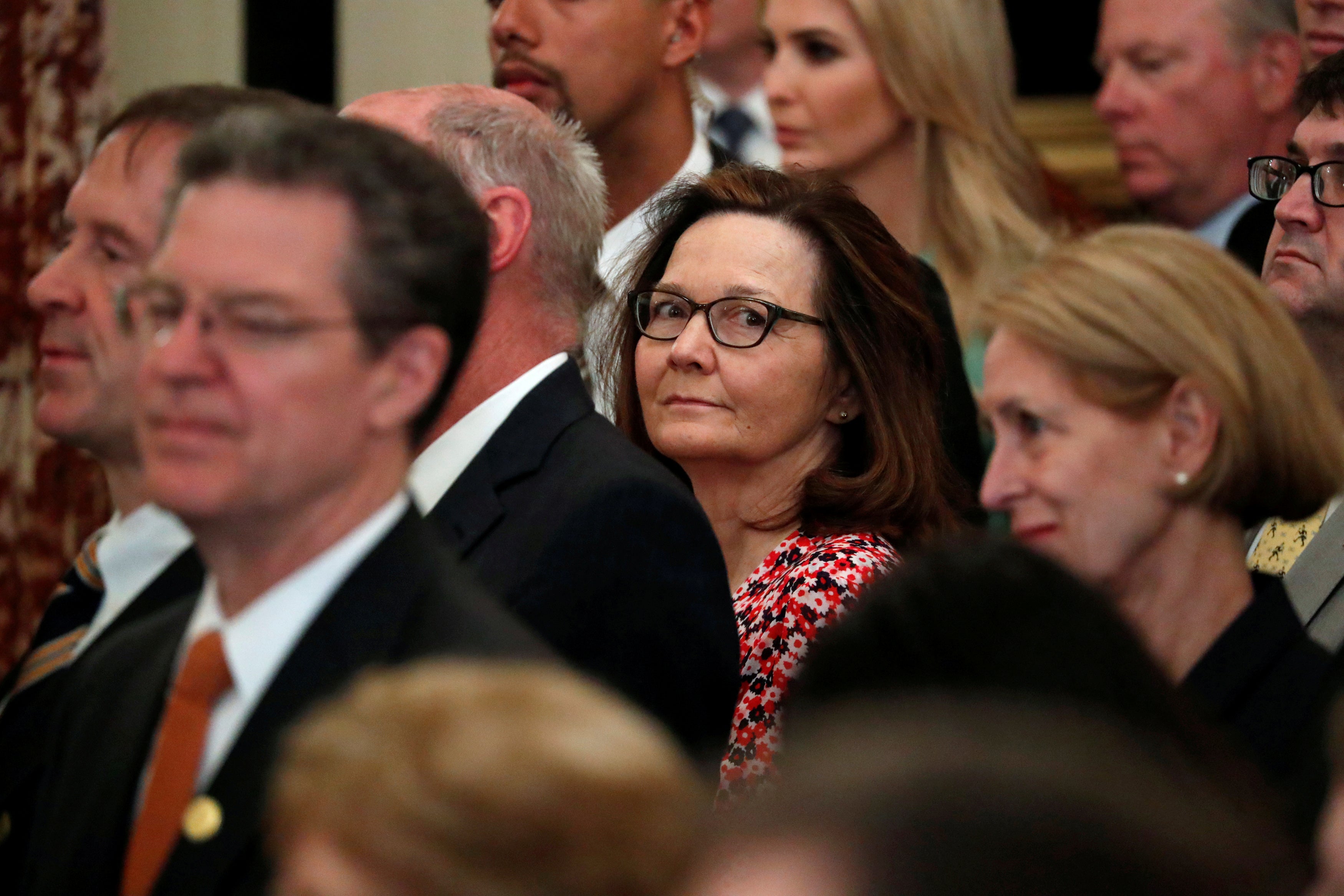 Central Intelligence Agency (CIA) director nominee Gina Haspel (C) attends Secretary of State Mike Pompeo's ceremonial swearing-in at the State Department in Washington on May 2, 2018. 