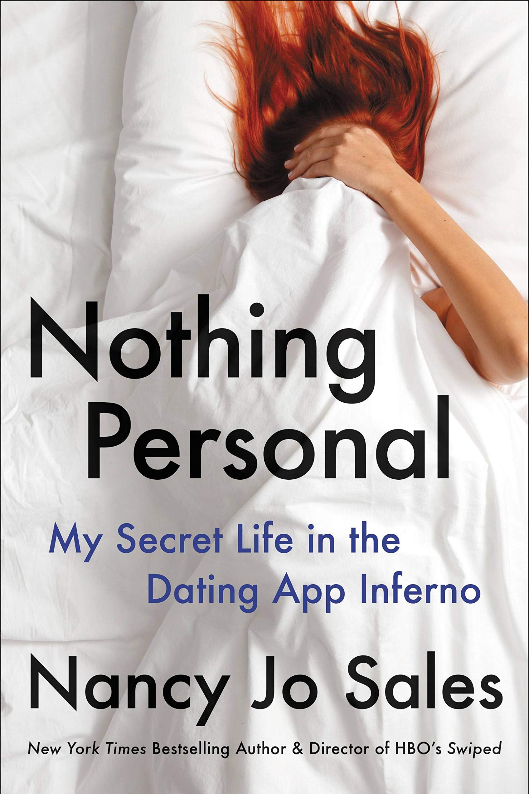 A book cover with a red-haired woman lying between white sheets. She is covering her face with the sheets. 