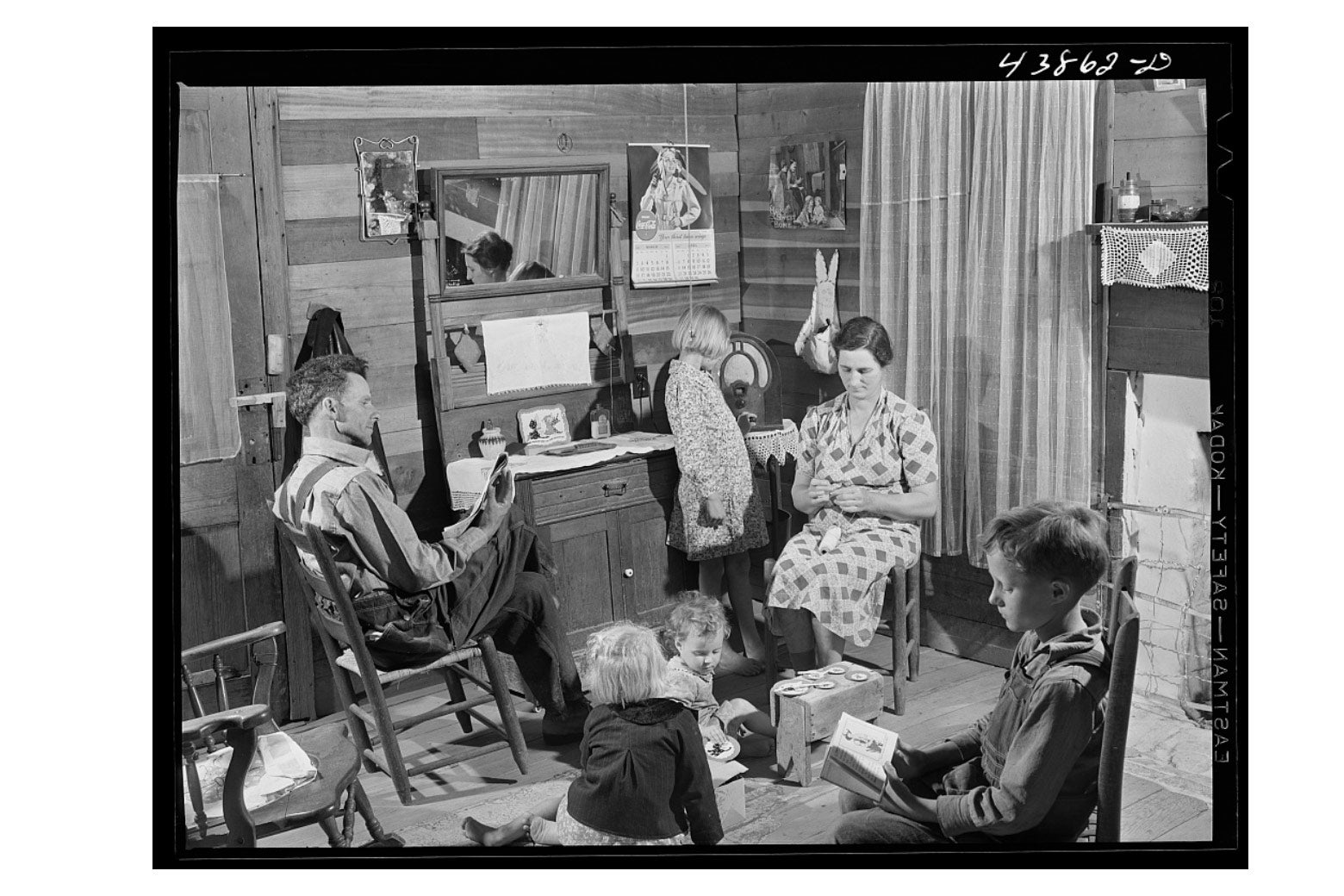 Mr. and Mrs. L. Smith and their younger children in their home on their farm in Carroll County, Georgia.