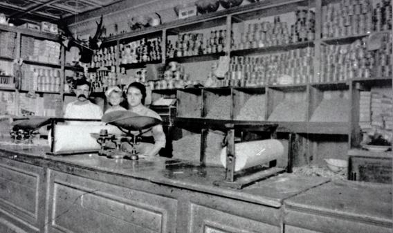 Giorgio Cataudella in his Harlem Macaroni Co. retail shop with his daughters Vera, center, and Antoinette.