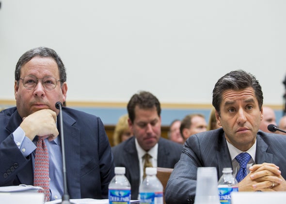 David Cohen, executive vice president of Comcast, and Robert Marcus, CEO of Time Warner Cable, attend a hearing on their proposed merger in May 2014.