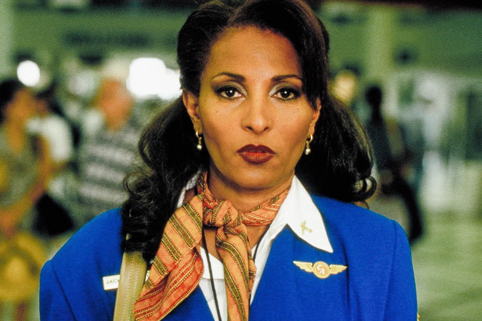 Pam Grier in a flight attendant's blue uniform in Jackie Brown