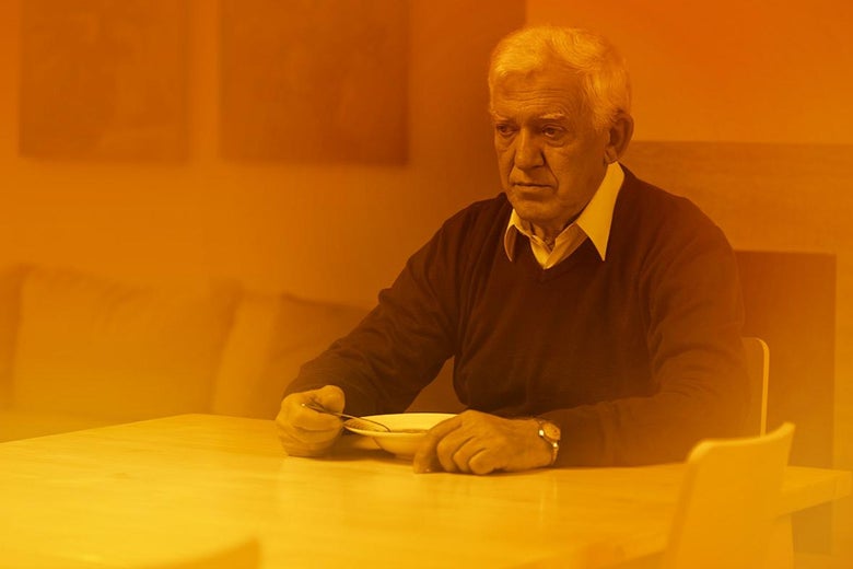 A sad man eats alone.