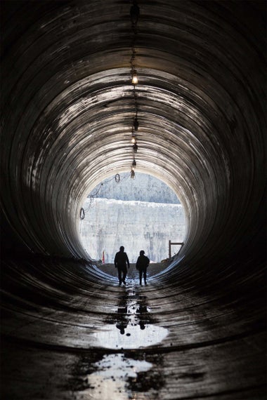 Construction workers exit the Deep Tunnel. 