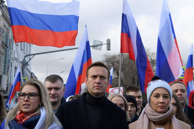 Russian opposition leader Alexei Navalny, his wife Yulia, opposition politician Lyubov Sobol and other demonstrators take part in a march in memory of murdered Kremlin critic Boris Nemtsov in downtown Moscow on February 29, 2020.