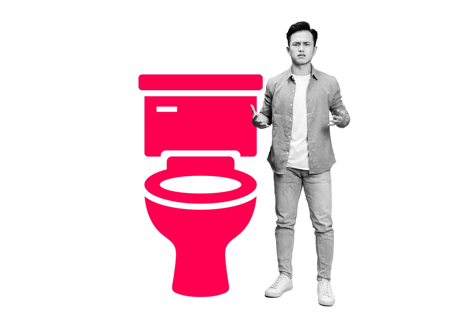 A guy stands upset next to a toilet.