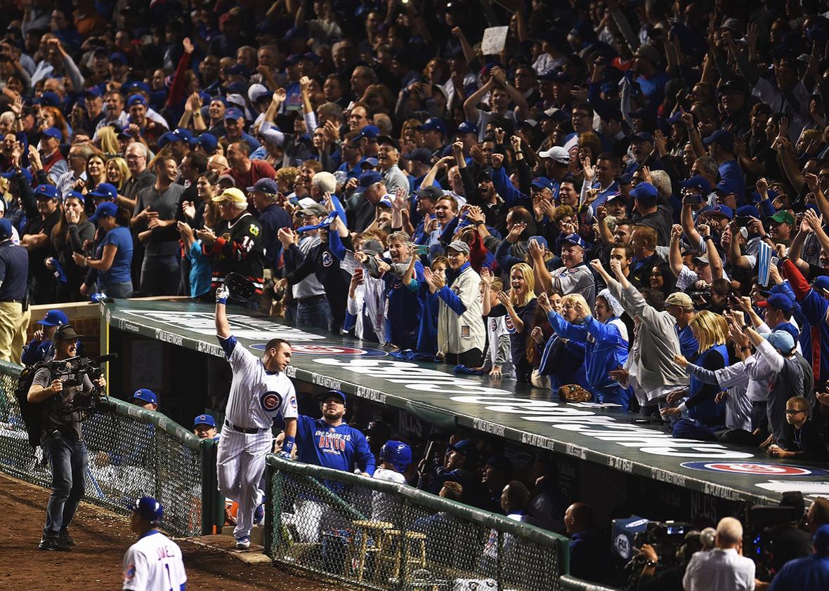 Miguel Montero #47 of the Chicago Cubs celebrates at the dugout after hitting a grand slam home run in the eighth inning against the Los Angeles Dodgers during game one of the National League Championship Series at Wrigley Field on October 15, 2016 in Chicago, Illinois.  