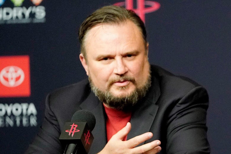 Morey, seated, speaks into a mic with Rockets branding