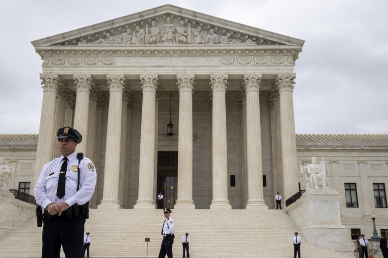 Police stand outside the Supreme Court.