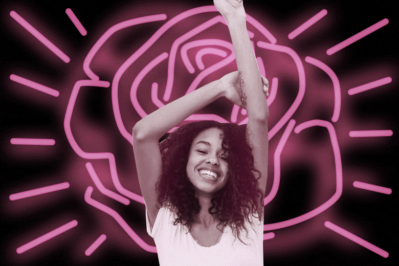 Happy woman stretching her arms towards the sky on top of a glowing rose.