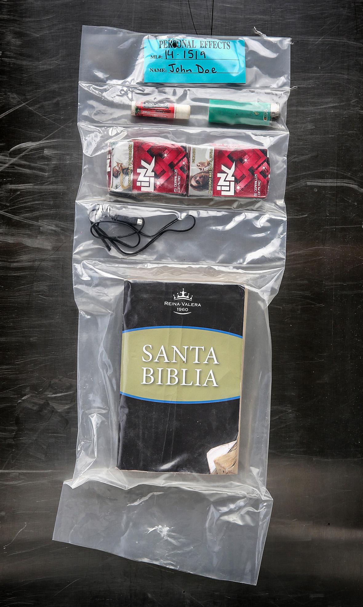 Chapstick, a lighter, cigarettes, a power chord, and a bible, found on the mummified remains of a Guatemalan male in the Arizona desert on June 19, 2014. 