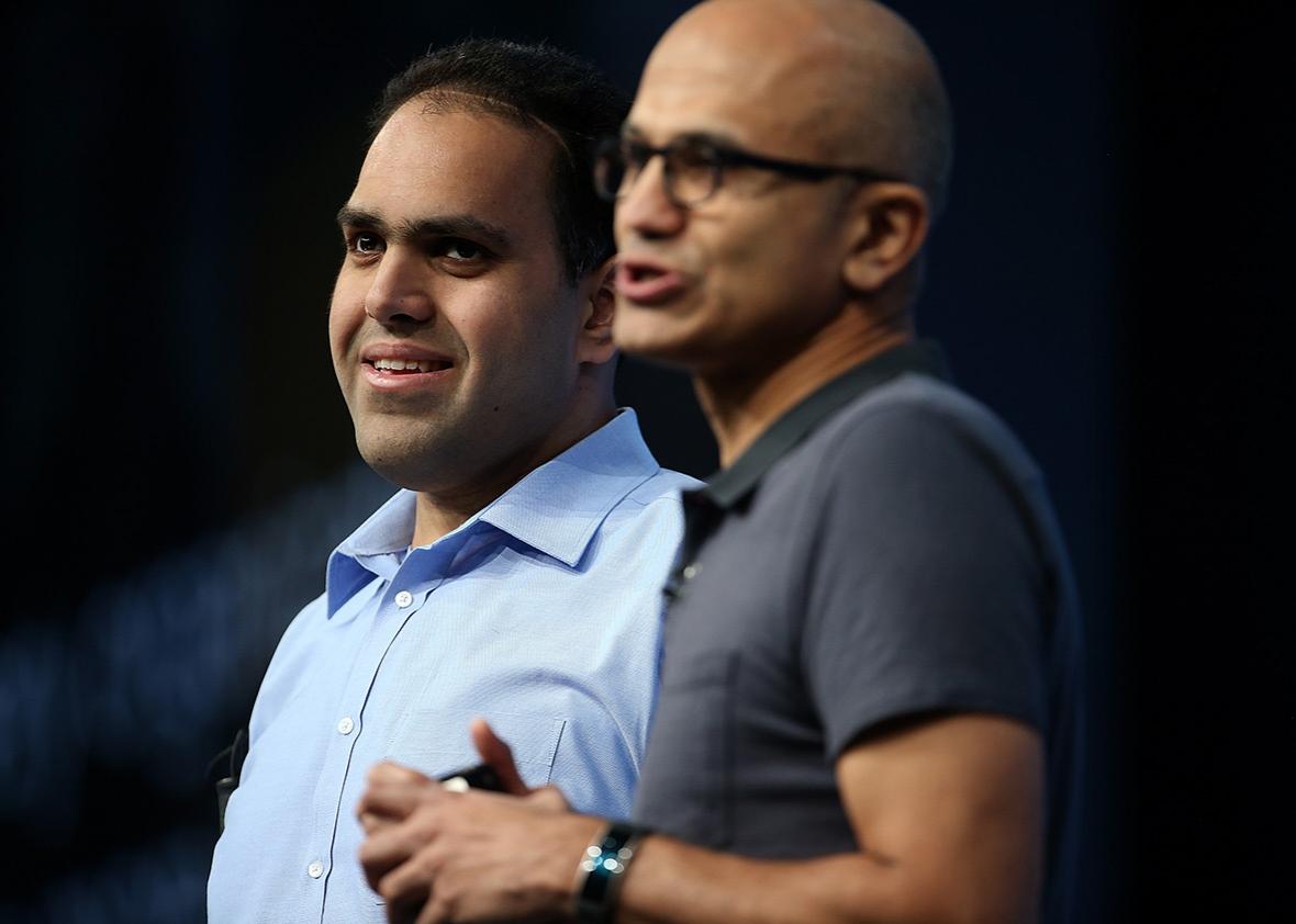 From left, visually impaired Microsoft developer Saqib Shaikh stands next to CEO Satya Nadella during his keynote address at the 2016 Microsoft Build Developer Conference on March 30 in San Francisco.