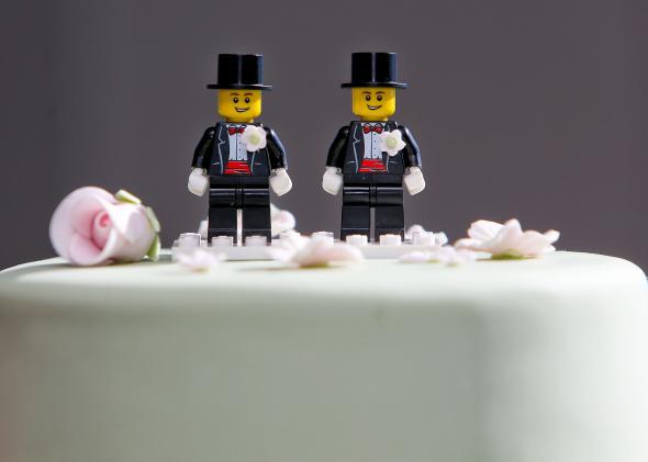 Two Lego men decorate the top of a wedding cake in Wellington, New Zealand. 176909561HH028_First_Austra